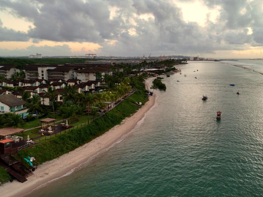 Flight with DJI Mini 4 Pro drone. View of a beach with boats on it.