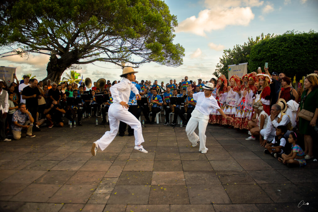 Street photography featuring two dancers performing 'frevo'