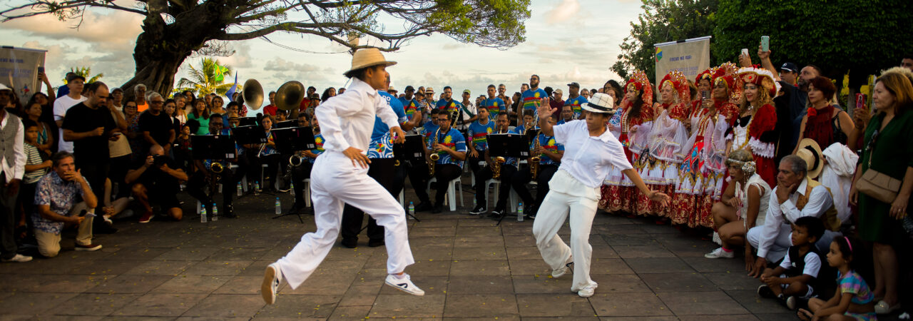 Two dancers dancing "frevo" in the street