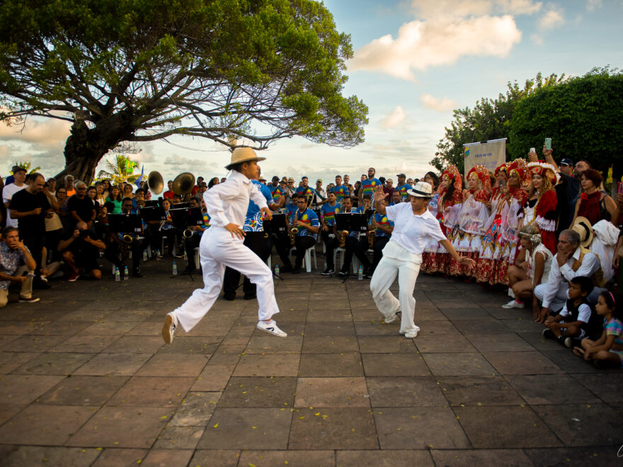 Two dancers dancing "frevo" in the street